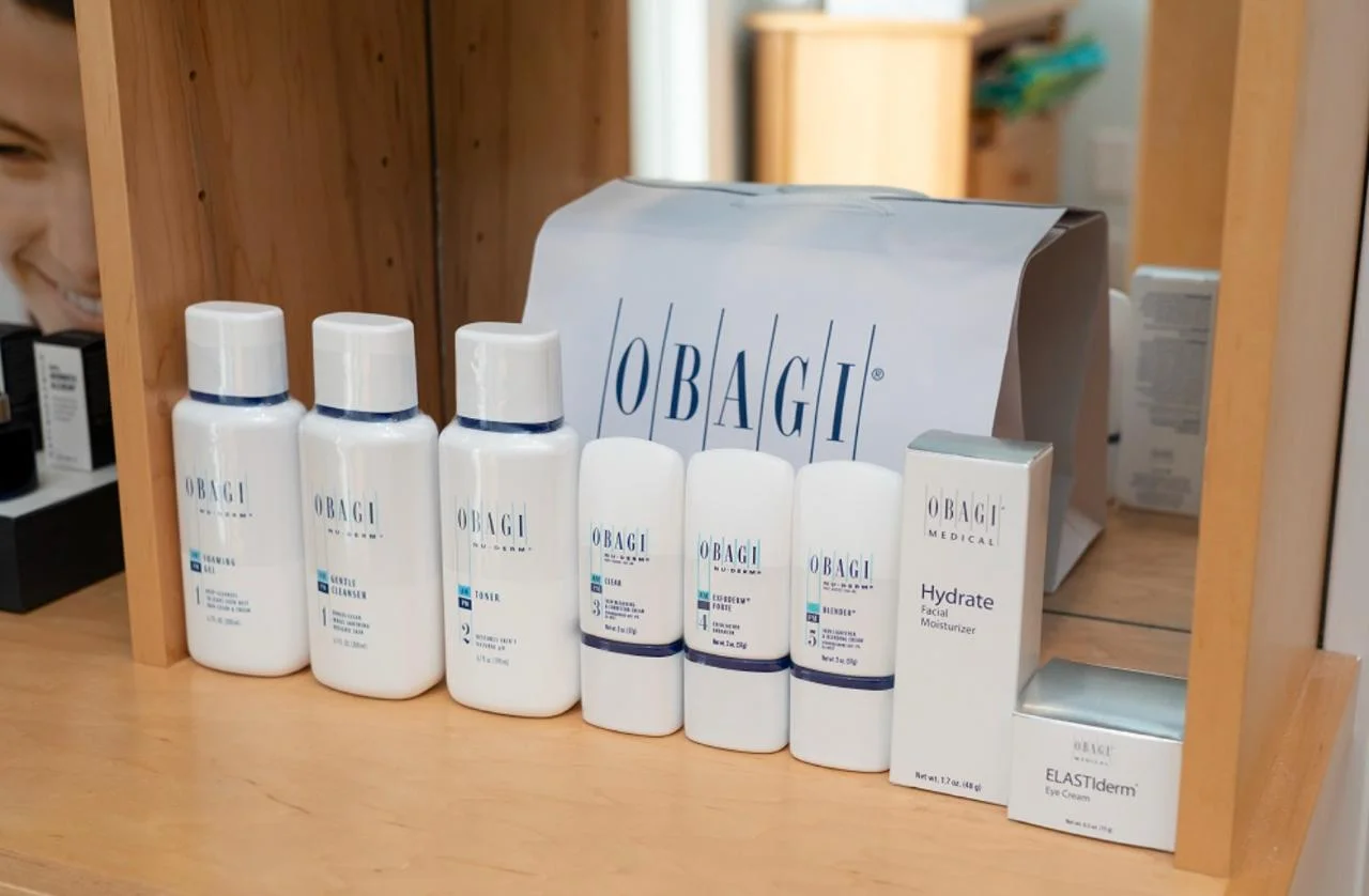 a group of white bottles and a bag