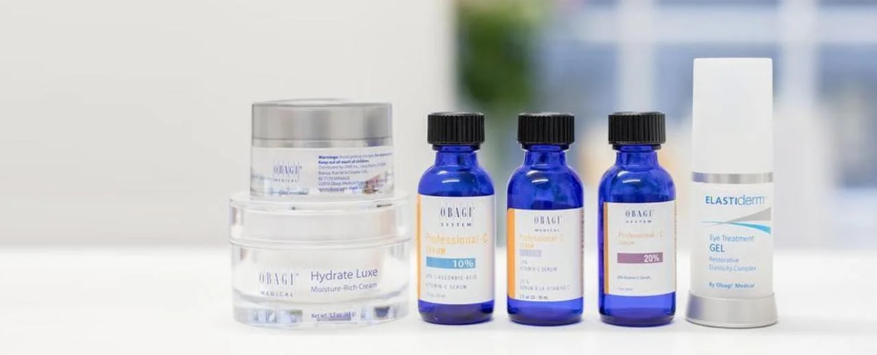 a group of blue bottles and a clear container