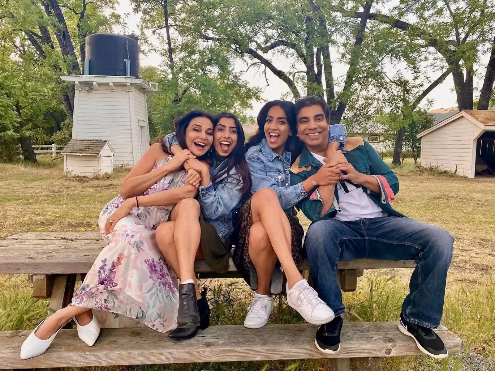 a group of people sitting on a bench