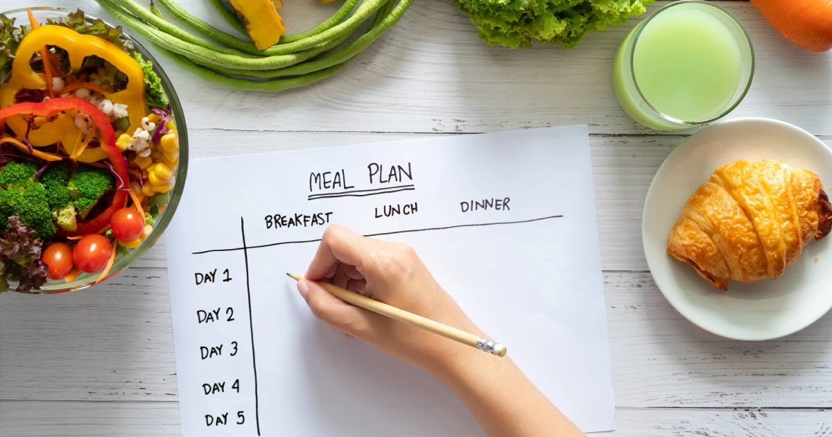 op-down view of a person planning meals with healthy food, showcasing Weight Loss Treatment in San Ramon, CA.